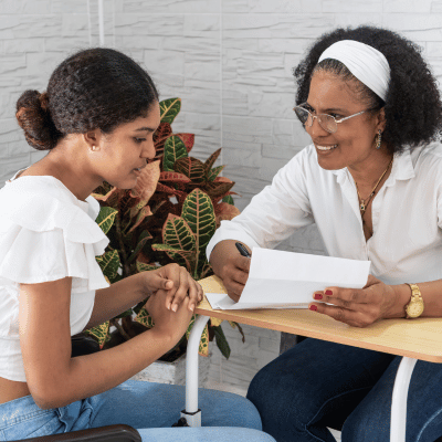 Adult woman mentoring young student